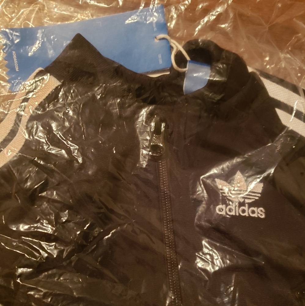 Adidas track suit. new with tags. Size 9M